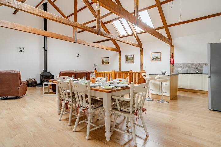 Dining area in kestrel cottage at Woodbury farm holiday cottages